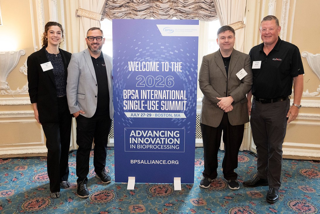 The Alphinity and ConSynSys team at the BPSA 2026 welcome banner.